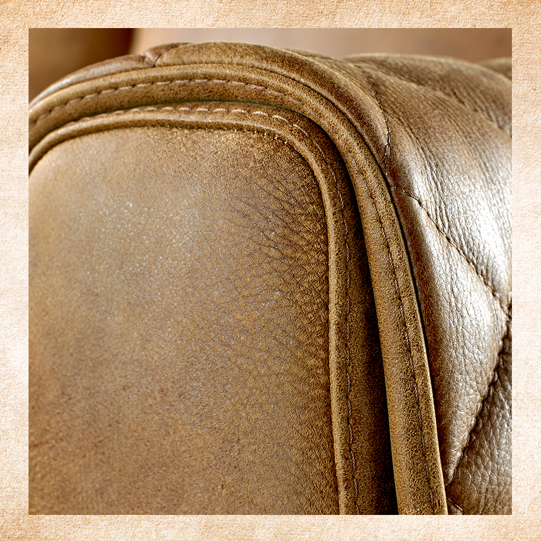 Closeup of arm of Sofology Mazzini brown leather sofa